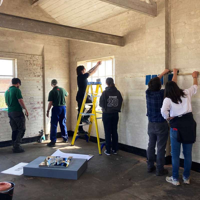 Installing student work in the Power House on Orford Ness