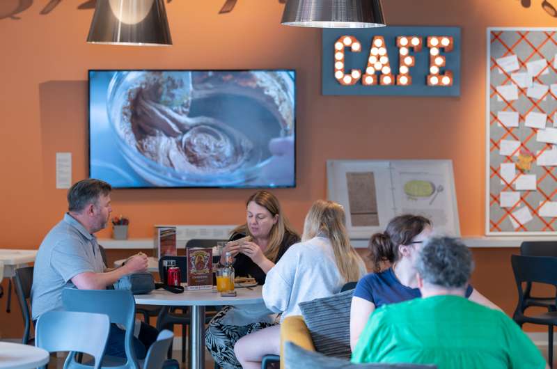 People eating at the cafe inside The Hold