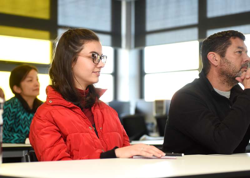 A student sitting in a talk at an Open Day