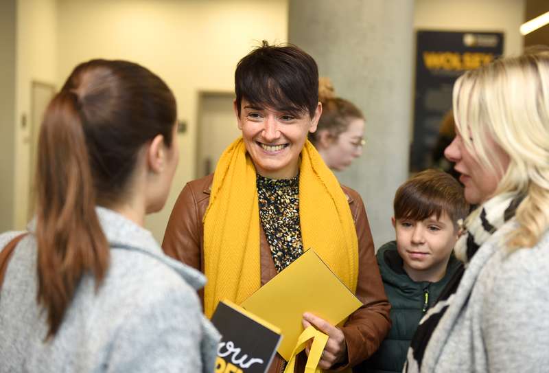 Students talking in a foyer