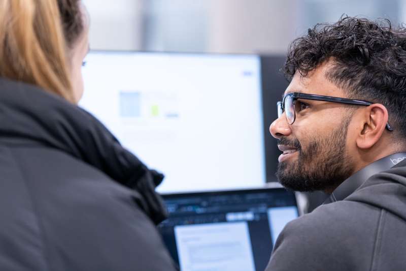 Close-up of two students at a computer