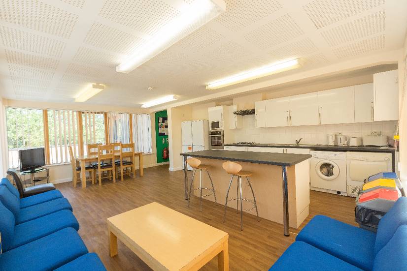 A large student kitchen with social seating area