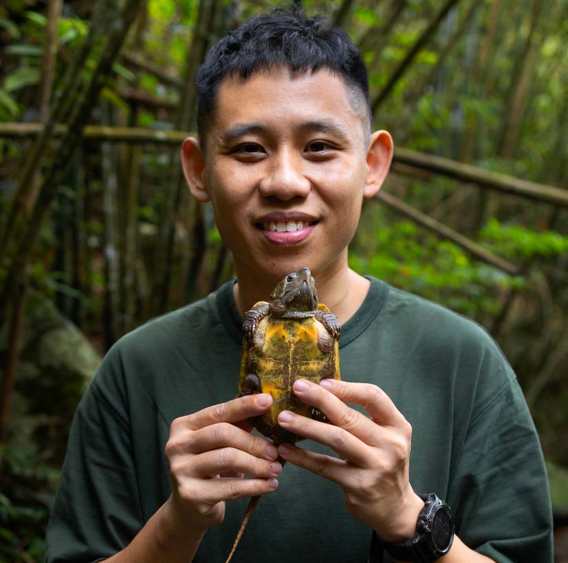Dr Hei Sung in Hong Kong holding a young Big-headed turtle. Image credit: Jame Kwok and Daphne Wong