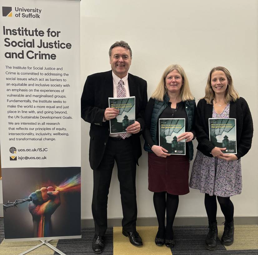 Left to right Dr Mark Manning, Dr Isabella Boyce and Dr Jennifer Coe, holding their research report on Top Up Shops Ipswich. They are standing next to a banner that says 'Institute for Social Justice and Crime'