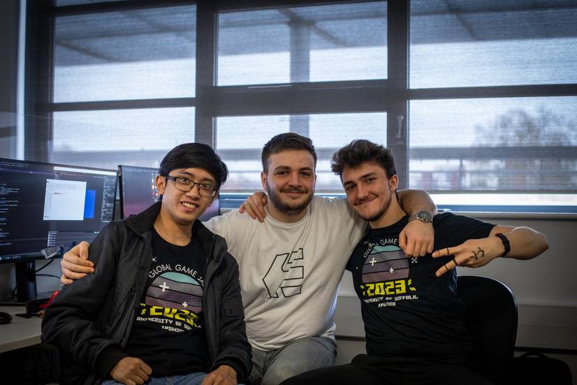 Three gaming students looking at the camera
