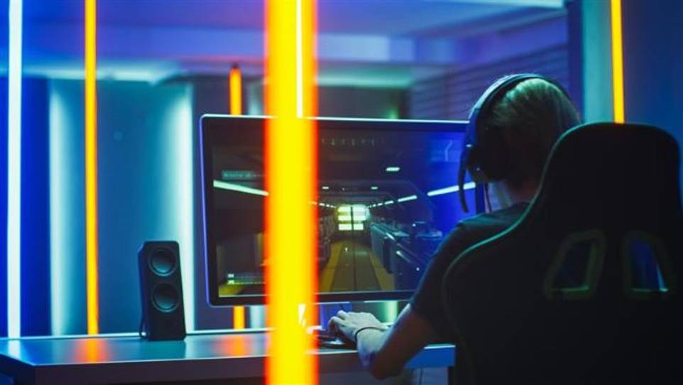 Esports student on computer image for registration